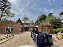 Under construction, this large brick home features multiple gables and a new roof at 4305 Windsor Pl, Raleigh, NC 27609