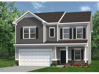 Charming two-story home with a two-car garage, landscaped yard, and neutral color palette at 68 Victory View Ter, Smithfield, NC 27577