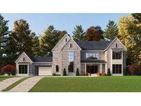 Charming two-story home with cedar shake siding, a shingle roof, and a well-manicured lawn at 214 Reynolds Rd, Raleigh, NC 27609