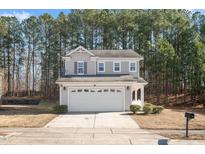 Charming two-story home featuring a spacious two-car garage and a well-maintained front yard at 912 Obsidian Way, Durham, NC 27703