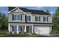 Charming two-story home with gray siding, dark shutters, and a well-manicured lawn at 124 Ethel Ln, Angier, NC 27501