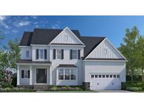 Beautiful two story traditional home with white siding, black shutters and a two car garage at 332 Ivy Ridge Rd, Chapel Hill, NC 27516