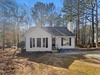 Charming single-story home features a classic design with a chimney and cozy curb appeal at 712 Grandview Dr, Durham, NC 27703