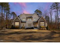 Stunning two-story home showcasing manicured lawn, neutral color palette, and a welcoming facade at 7212 Summer Tanager Trl, Raleigh, NC 27614