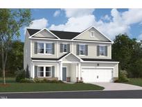 Charming two-story home featuring a combination of siding and brick, complemented by green shutters and a two-car garage at 1225 Dimaggio Dr # 9, Raleigh, NC 27616