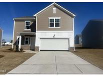 Beautiful new construction home featuring a large garage and neutral siding, ready for personalization at 1137 Centerview Dr, Nashville, NC 27856
