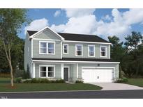 Charming two-story home with neutral siding, black roof, attached two-car garage, and professionally landscaped front yard at 1240 Dimaggio Dr # 35, Raleigh, NC 27616