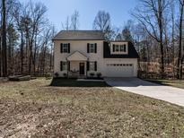 Charming two-story home featuring a paved driveway and a well-maintained front lawn at 2218 Christian Light Rd, Fuquay Varina, NC 27526