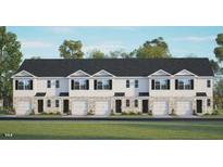 Newly constructed townhomes featuring a blend of modern design with private garages and a sleek black roof at 309 Cherry Laurel Dr, Sanford, NC 27332