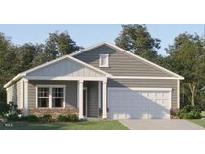 Charming single-story home with gray siding, white trim, covered entry, and attached two-car garage at 532 Morning Light Dr, Angier, NC 27501