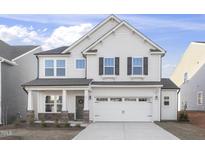 Charming two-story home with white siding, black shutters, and a welcoming front porch at 27 Silver Moon Ln # 114, Clayton, NC 27527