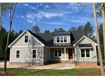 Charming craftsman-style home with gray siding, a stone foundation, and a well-manicured lawn at 3909 Cedar Knolls Dr # 6, Youngsville, NC 27596