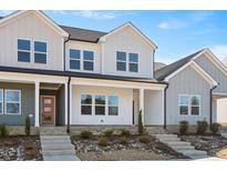 Charming new construction townhomes feature a welcoming entrance, and a meticulously landscaped front yard at 3920 Willow Gate Way, Raleigh, NC 27604