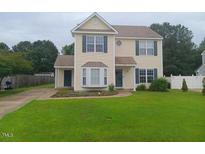 Charming two-story home with neutral siding, well-maintained lawn, and inviting curb appeal at 711 Weathervane Way, Rocky Mount, NC 27803