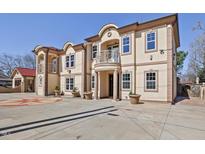 Stately two-story home featuring a symmetrical facade and decorative concrete driveway at 318 W Lillington St, Angier, NC 27501