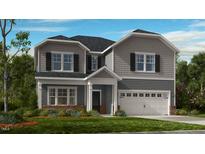 Charming two-story home with gray siding, black shutters, and well-manicured front yard at 109 Hiddenite Pl, Holly Springs, NC 27540