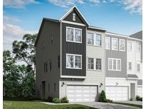 New two-story townhome with an attached two-car garage, modern architectural details, and neutral color palette at 2013 Trident Maple Ln, Chapel Hill, NC 27517