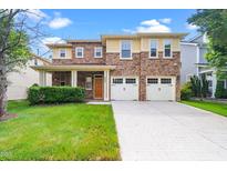 Charming two-story home featuring a stone facade, covered porch, and two-car garage at 532 Front Ridge Dr, Cary, NC 27519