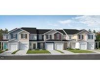 Charming new construction townhomes featuring diverse colors, private garages and inviting curb appeal at 154 Parker Ln, Mebane, NC 27302