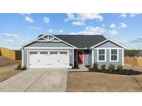 Charming single-Gathering home with a well-maintained front yard, garage, and a vibrant red front door at 45 Florentine Ct, Angier, NC 27501