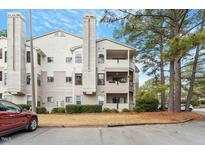 Attractive multi-story condo with a view, set amidst lush landscaping and mature trees at 600 Audubon Lake Dr # 5A32, Durham, NC 27713