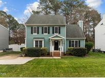 Charming two-story home features a manicured lawn and traditional architecture at 8304 Bellingham Cir, Raleigh, NC 27615