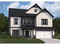 Beautiful two-story home featuring modern architectural design, attached two-car garage, and manicured lawn at 100 N Stonemill Trl # Homesite 252, Clayton, NC 27520