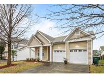 Charming single-story home boasts a two-car garage and a welcoming front porch at 2815 Mebane Ln, Durham, NC 27703