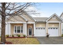 Charming single-story home with a two-car garage, covered porch, and well-maintained front yard at 2815 Mebane Ln, Durham, NC 27703