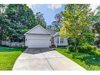 Charming single-Gathering home with a two-car garage and a well-manicured lawn at 520 Hidden Cellars Dr, Holly Springs, NC 27540
