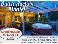 Inviting back porch featuring a hot tub and an outdoor grill for relaxation and entertainment at 1005 W Club Blvd, Durham, NC 27701