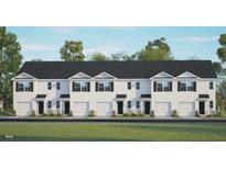 New townhomes boast traditional design, garage, black roof, and complementary trim details at 107 Holton St, Smithfield, NC 27577