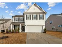 Charming two-story home with black shutters and a two car garage at 456 Highview Dr, Benson, NC 27504
