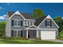 Charming two-story home with blue siding, white trim, shutters, and a covered front porch at 7128 Trappers Ct, Zebulon, NC 27597