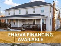 Charming two-story home with a welcoming front porch and FHA/VA financing available at 121 Hamilton St, Henderson, NC 27536