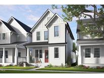 Charming two-story home with white siding, a red door, and a cozy front porch at 1907 Plott Balsam Dr, Wendell, NC 27591
