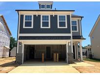 New two story home with a garage and a mix of shingle and gray siding at 79 Willow Cameron Way, Angier, NC 27501