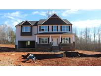 Charming two-story new construction home with covered front porch and an attached two car garage at 1414 Reading Ct # 91Kl, Burlington, NC 27217