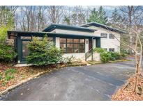 Attractive home featuring modern architecture with a large front yard and ample parking space at 1824 S Lakeshore Dr, Chapel Hill, NC 27514