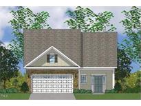 Charming traditional-style home with a prominent two-car garage and inviting front door at 235 Meadowbark Bnd # 26, Garner, NC 27529