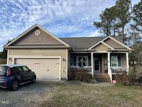 Charming single-Gathering home with a two-car garage and covered front porch at 2616 Pauline Oaks Dr, Franklinton, NC 27525