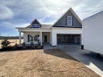 Charming single-Gathering home with a two-car garage and well manicured landscaping at 45 Trescott St, Smithfield, NC 27577