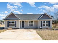 Charming single-story home featuring a well-maintained front yard and inviting entrance at 107 Rollingwood Cir, Kenly, NC 27542