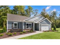 Charming single-story home with stone accents, gray siding, and a well-manicured lawn at 1008 Octans Way, Wendell, NC 27591