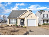 Charming single-story home with an attached garage, well-maintained lawn, and inviting curb appeal at 3416 Mogollon Ct, Raleigh, NC 27610