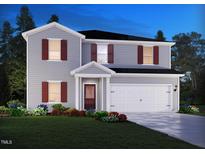 Charming two-story home with gray siding, red shutters, well-manicured lawn and an attached two-car garage at 1740 Pie Filling Dr, Haw River, NC 27258