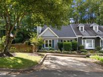 Charming home with a well-manicured lawn, inviting driveway, mature trees and lovely curb appeal at 131 Carriage House Trl, Garner, NC 27529