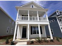 Charming two-story home boasting double porches and classic architectural details at 308 White Oak Garden Way # 215, Garner, NC 27529