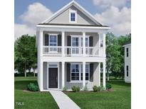 Charming two-story home with a welcoming front porch and classic architectural details at 308 White Oak Garden Way # 215, Garner, NC 27529