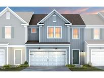 Charming two-story home with a two-car garage and a beautifully landscaped yard at 3412 Pelican Ln, Durham, NC 27703